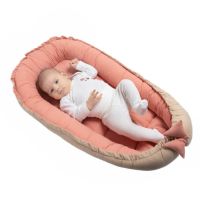 Cosulet bebelus pentru dormit din tesatura de in Kidizi Baby Nest Cocoon 90x50 cm Pink